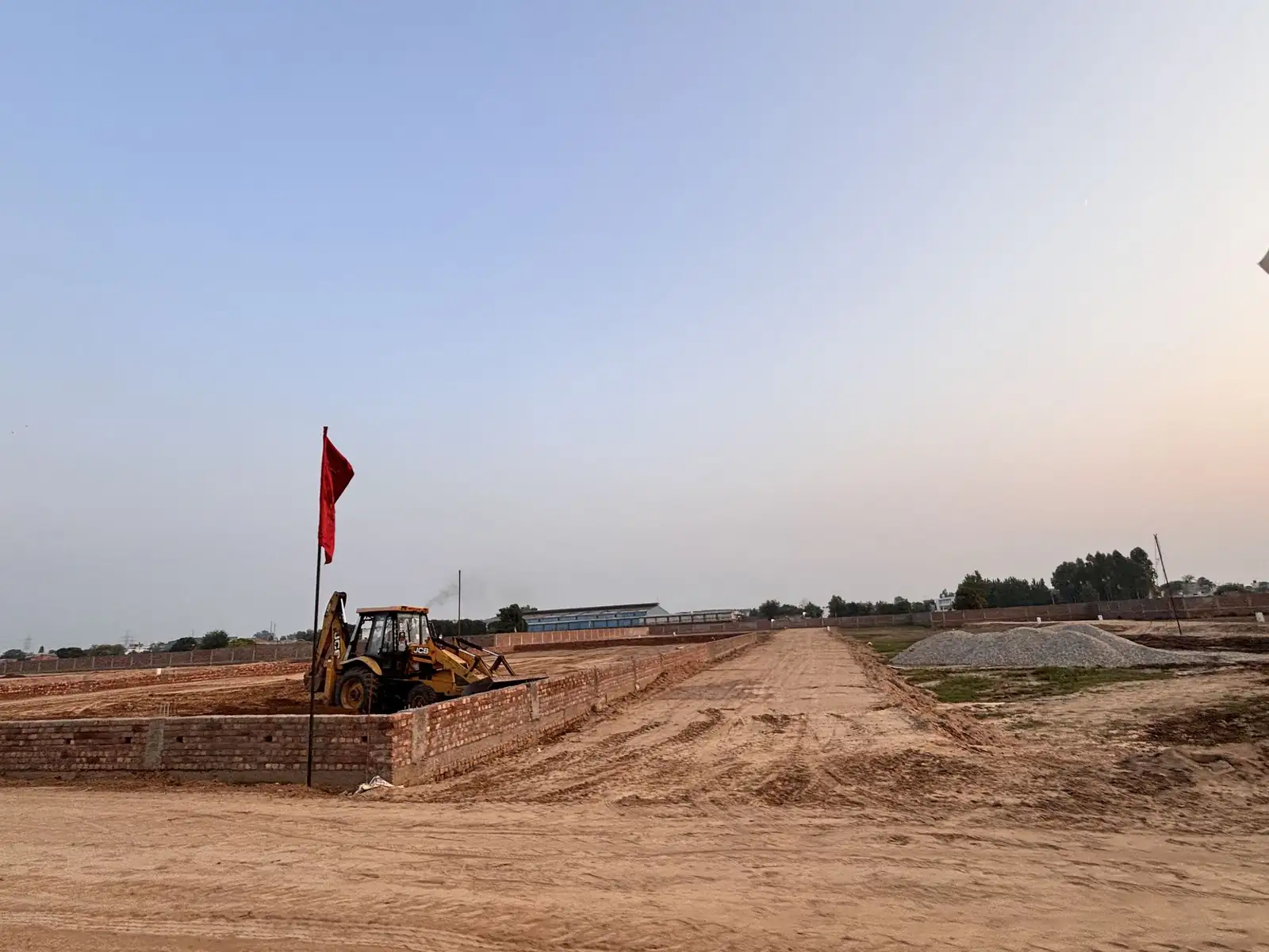 Excavator forming an internal road at The Ridge, Kurali