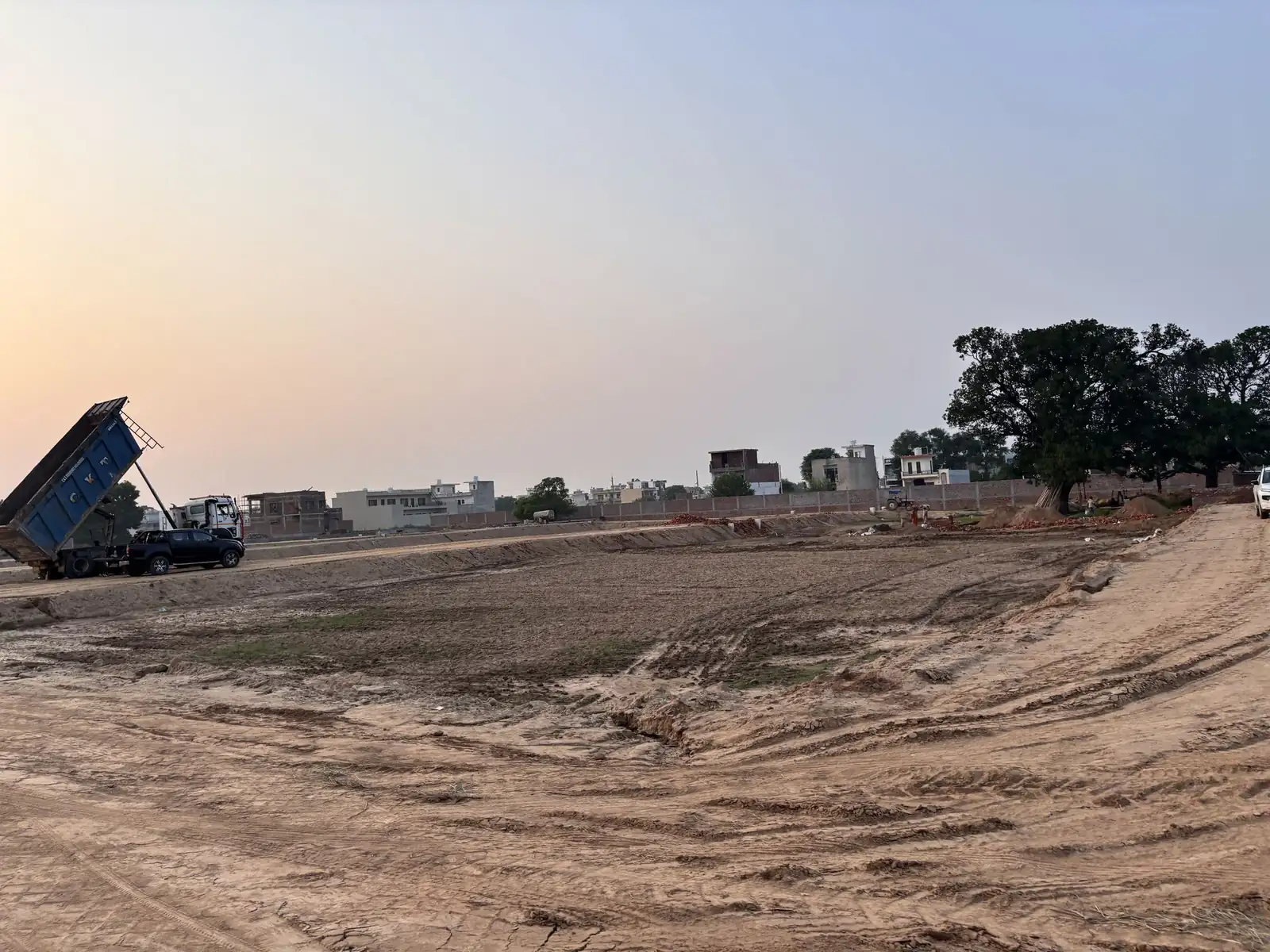 Site levelling work with a tipper truck at The Ridge, Kurali