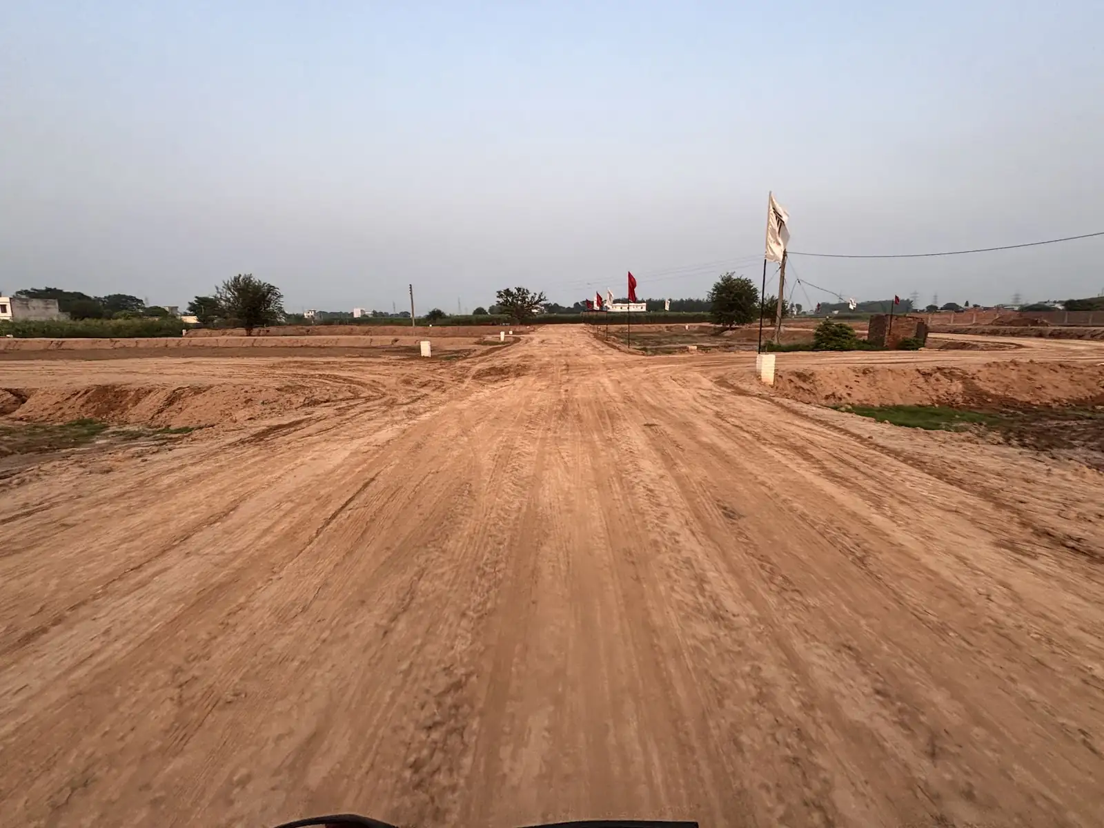 Long straight internal road under development at The Ridge plotted colony in Kurali